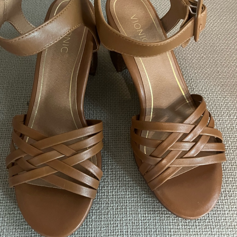 New Vionic sandals. Tan with woven 2” heal. Never worn. In original box.